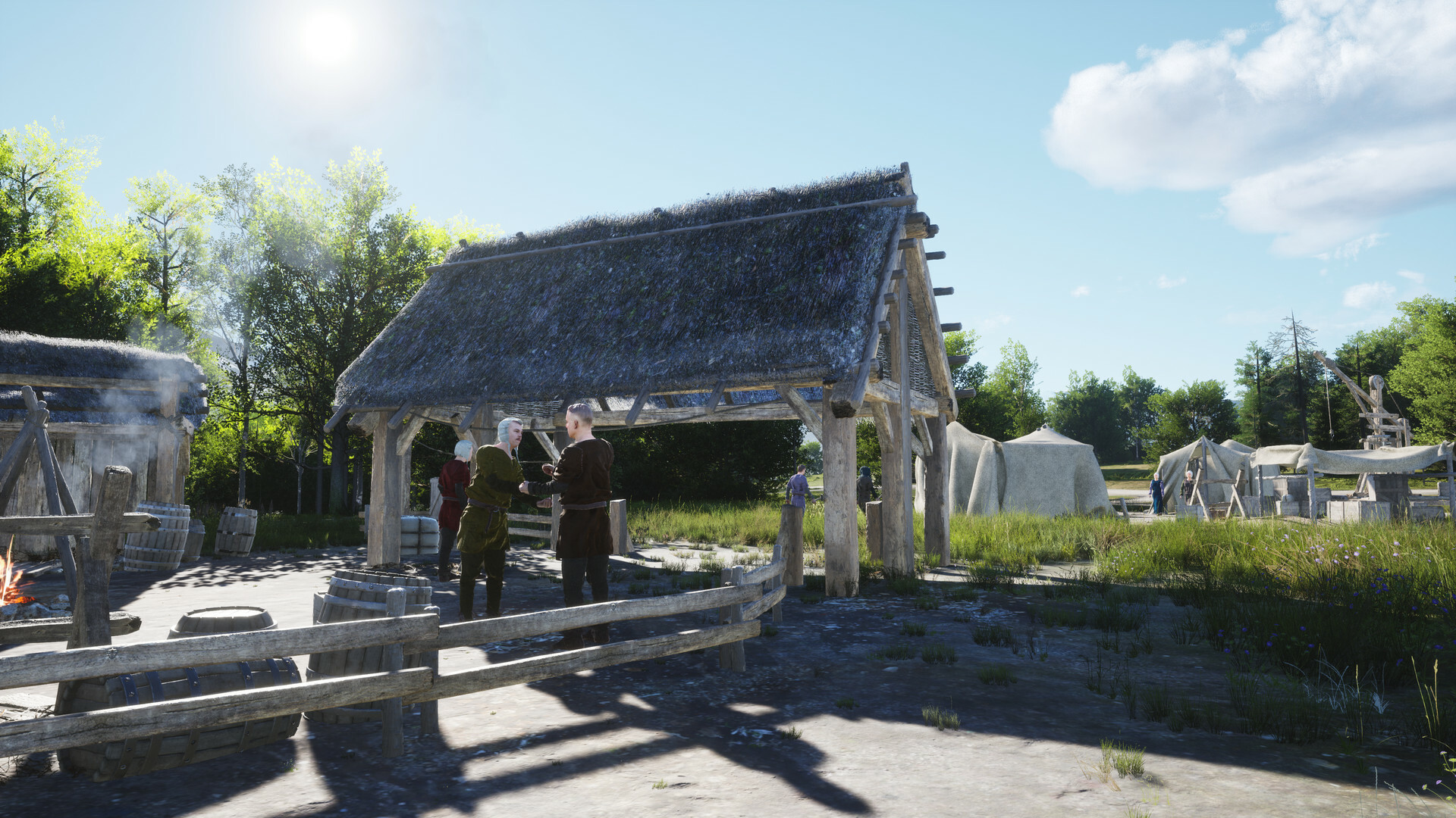 Screenshot of two villagers talking outside a barn in Manor Lords